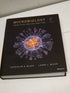 Microbiology: Principles and Explorations — used book cover